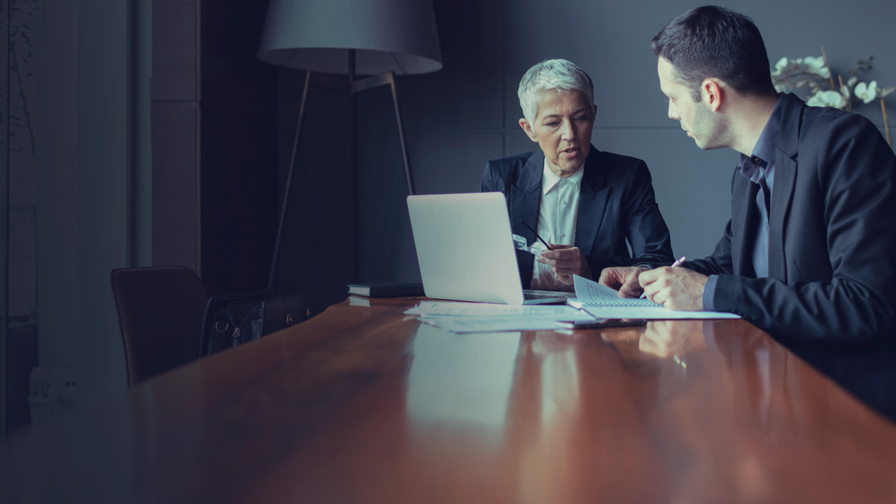 Formal business meeting with two persons 